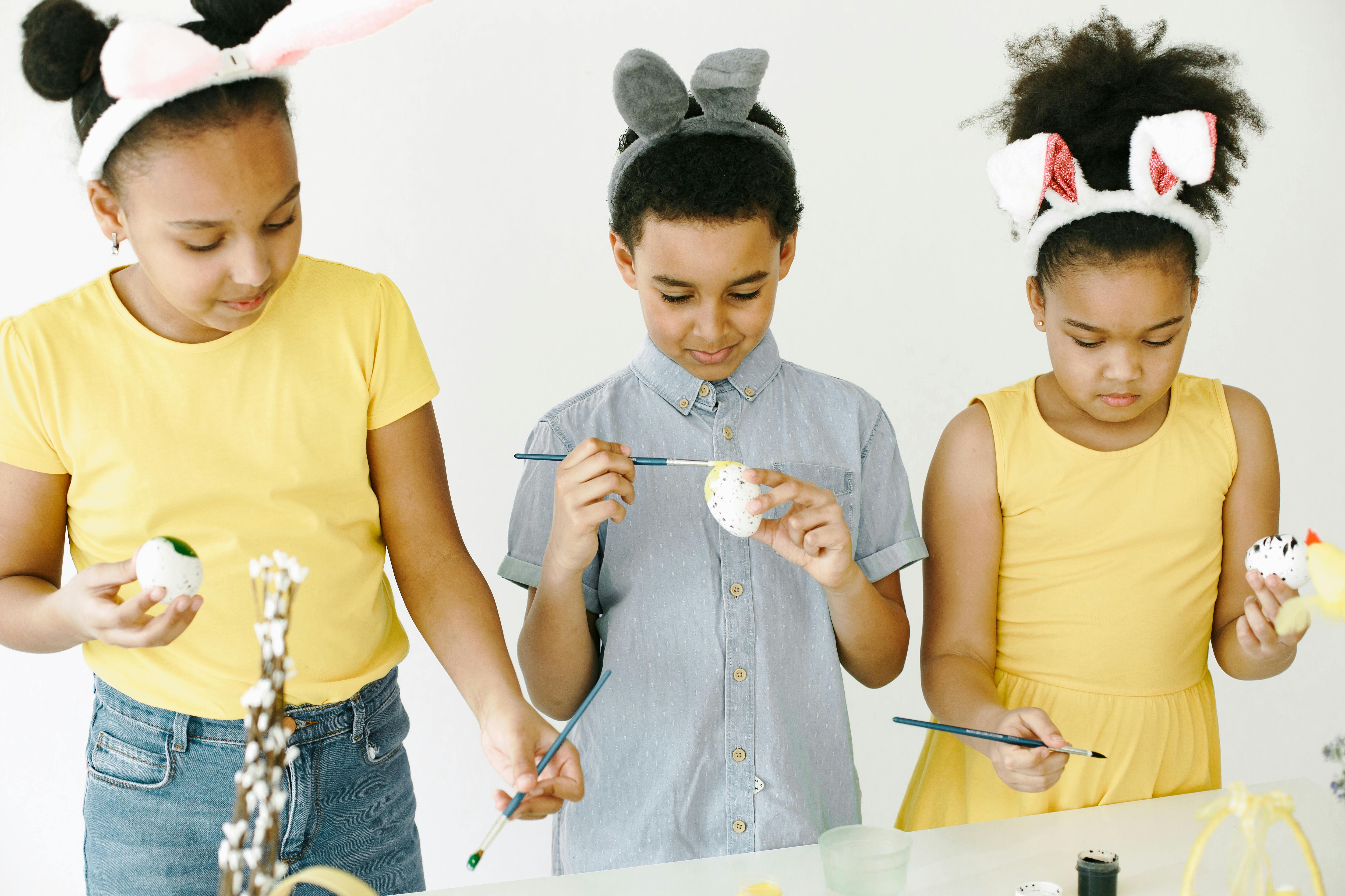 Children enjoying Easter themed activities and dress-up games at HAF holiday club